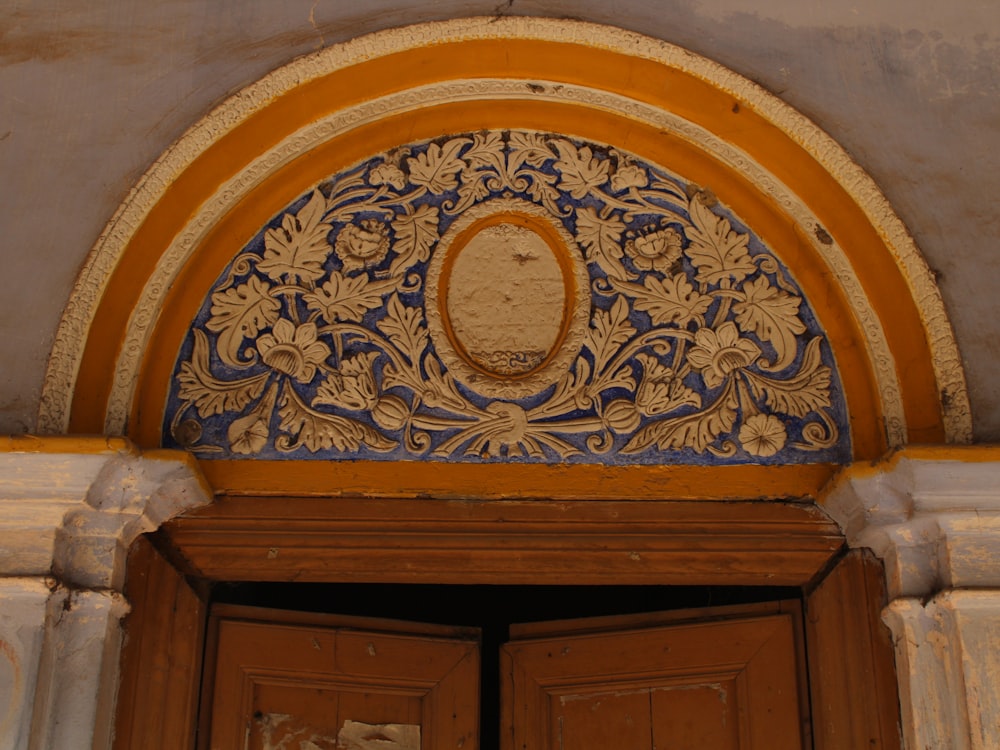 a wooden door with a decorative design on it