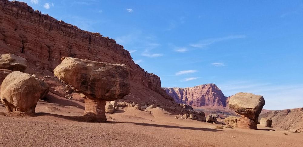 a rocky landscape with large rocks in the foreground