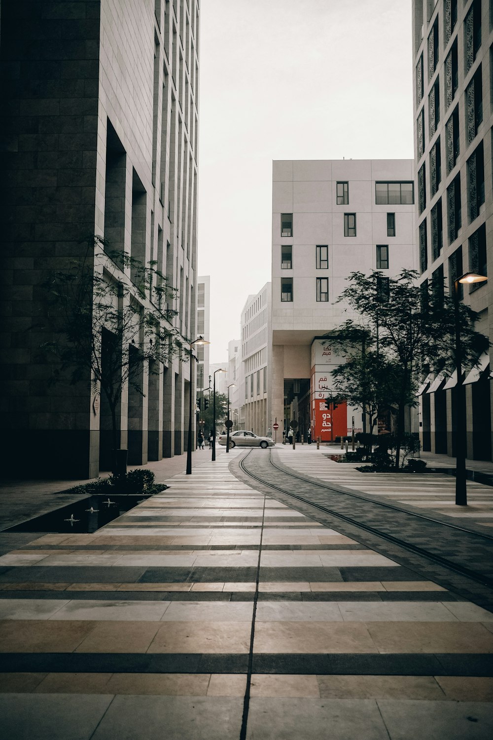 a city street with tall buildings on both sides