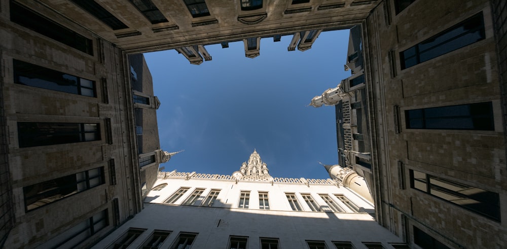 looking up at a tall building from the ground