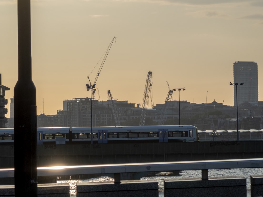 a train on a track near a body of water