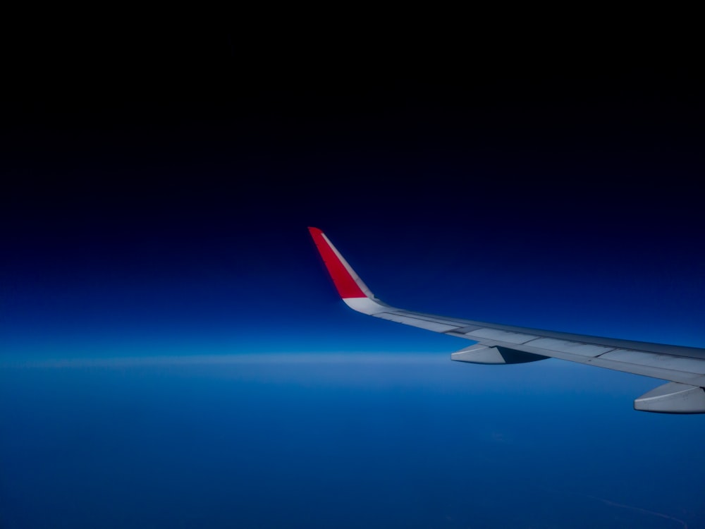 a view of the wing of an airplane in the sky