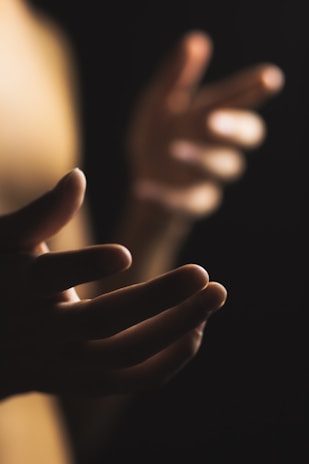 a blurry image of a woman's hands