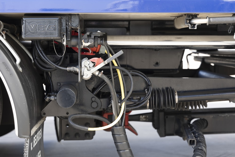 a close up of the front end of a blue truck