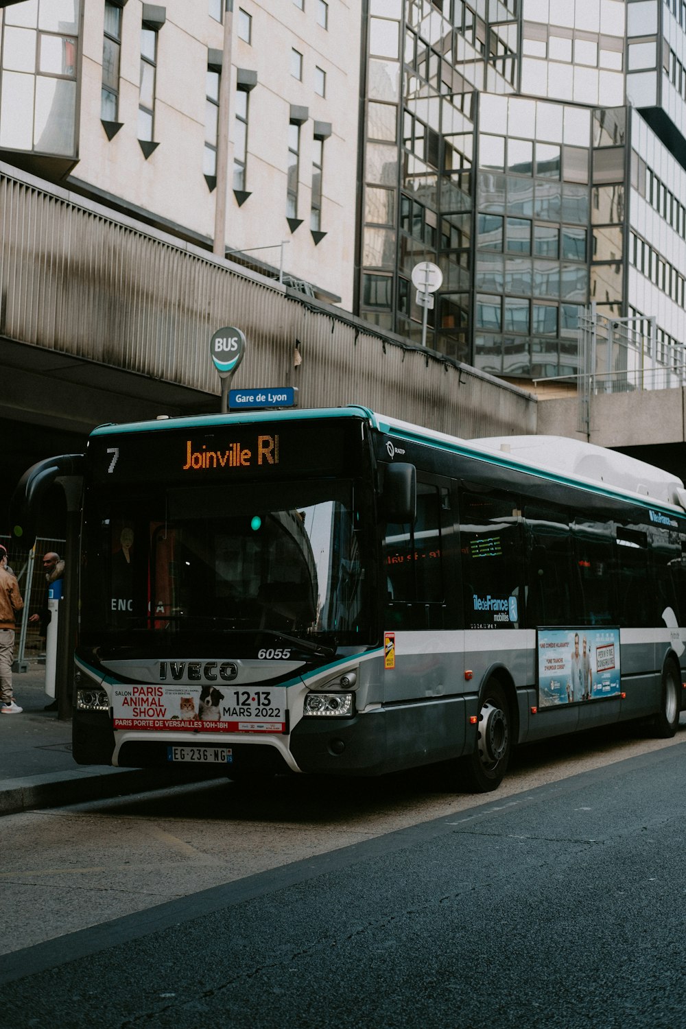 a bus is parked on the side of the street