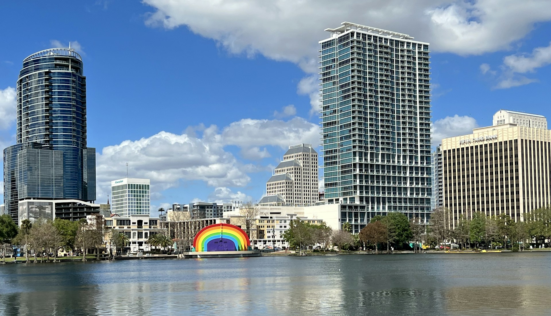 a rainbow painted on the side of a body of water