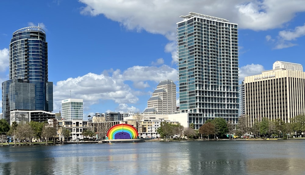 a rainbow painted on the side of a body of water