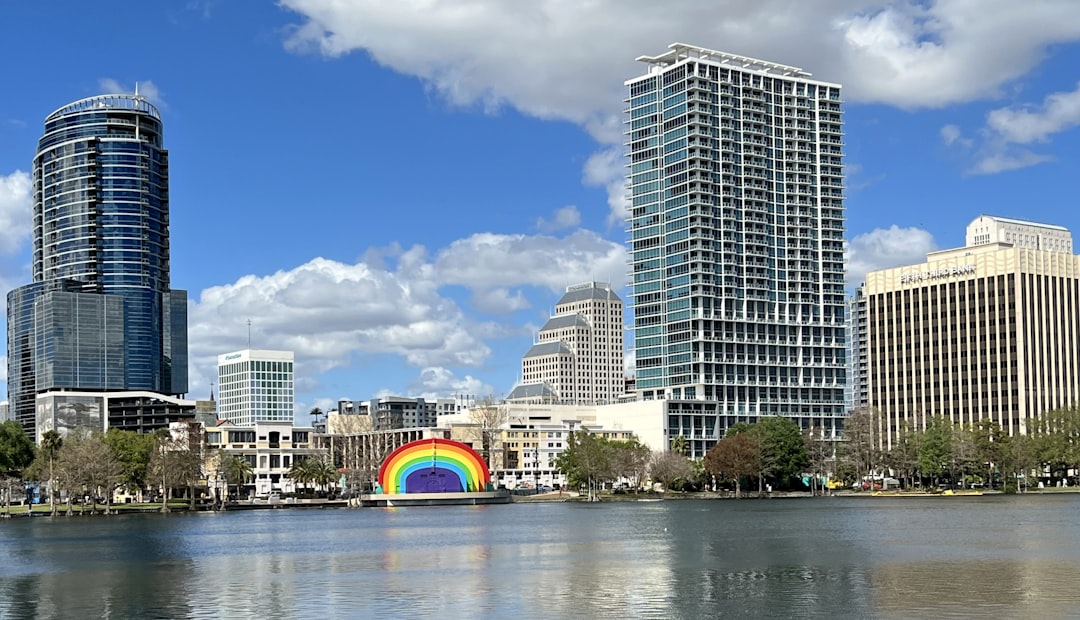 a rainbow painted on the side of a body of water,