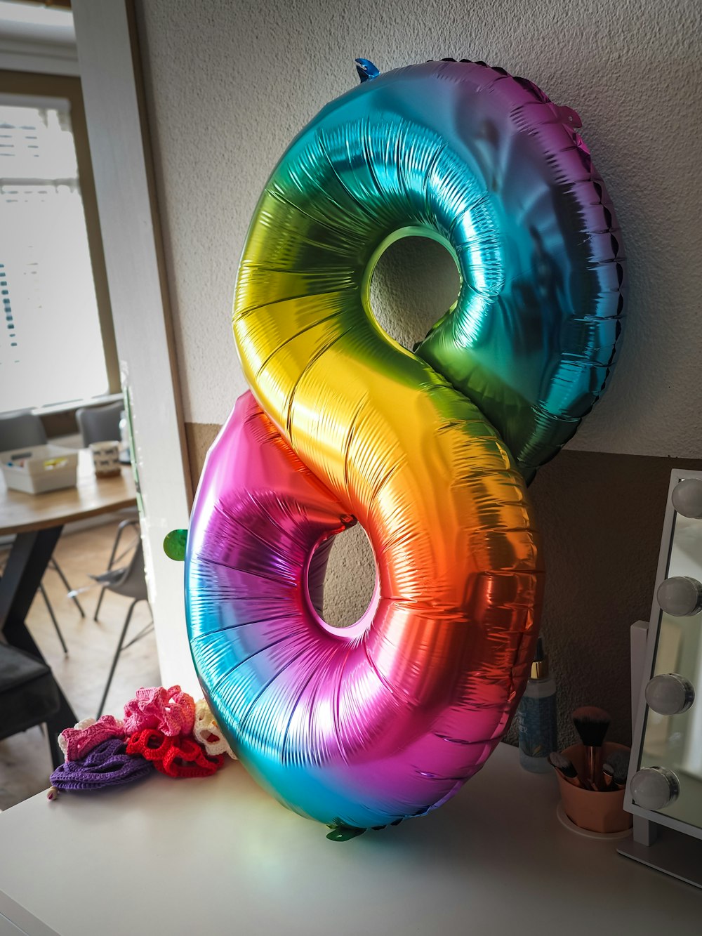 a number eight balloon sitting on top of a table