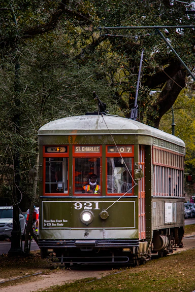 a trolley car on the tracks in a city
