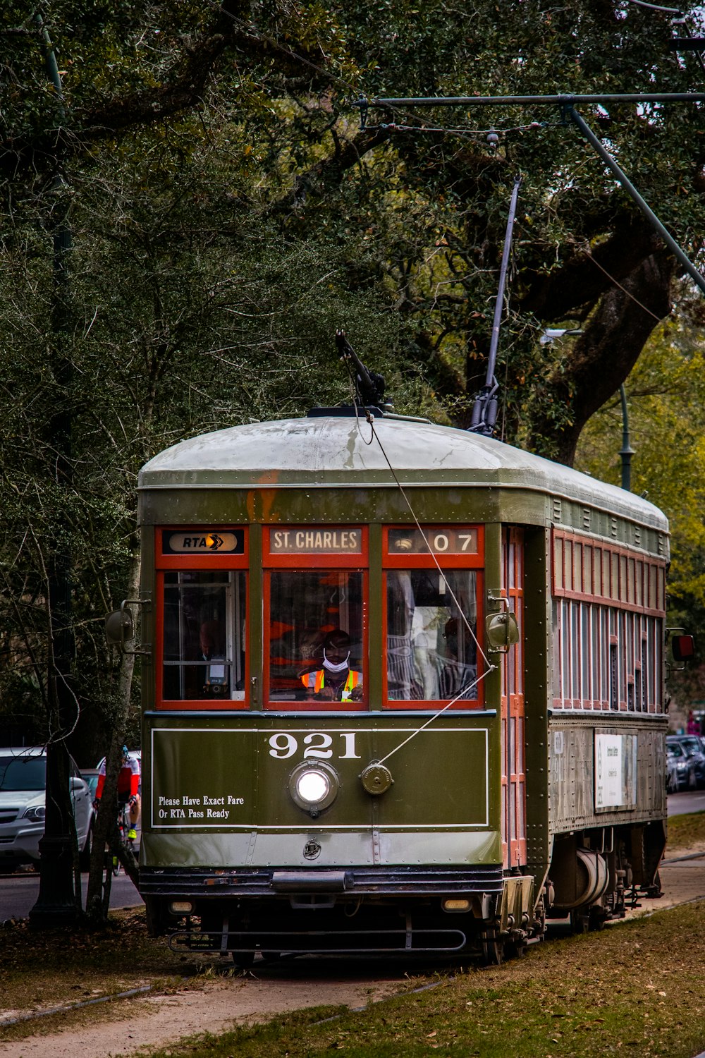 a trolley car on the tracks in a city