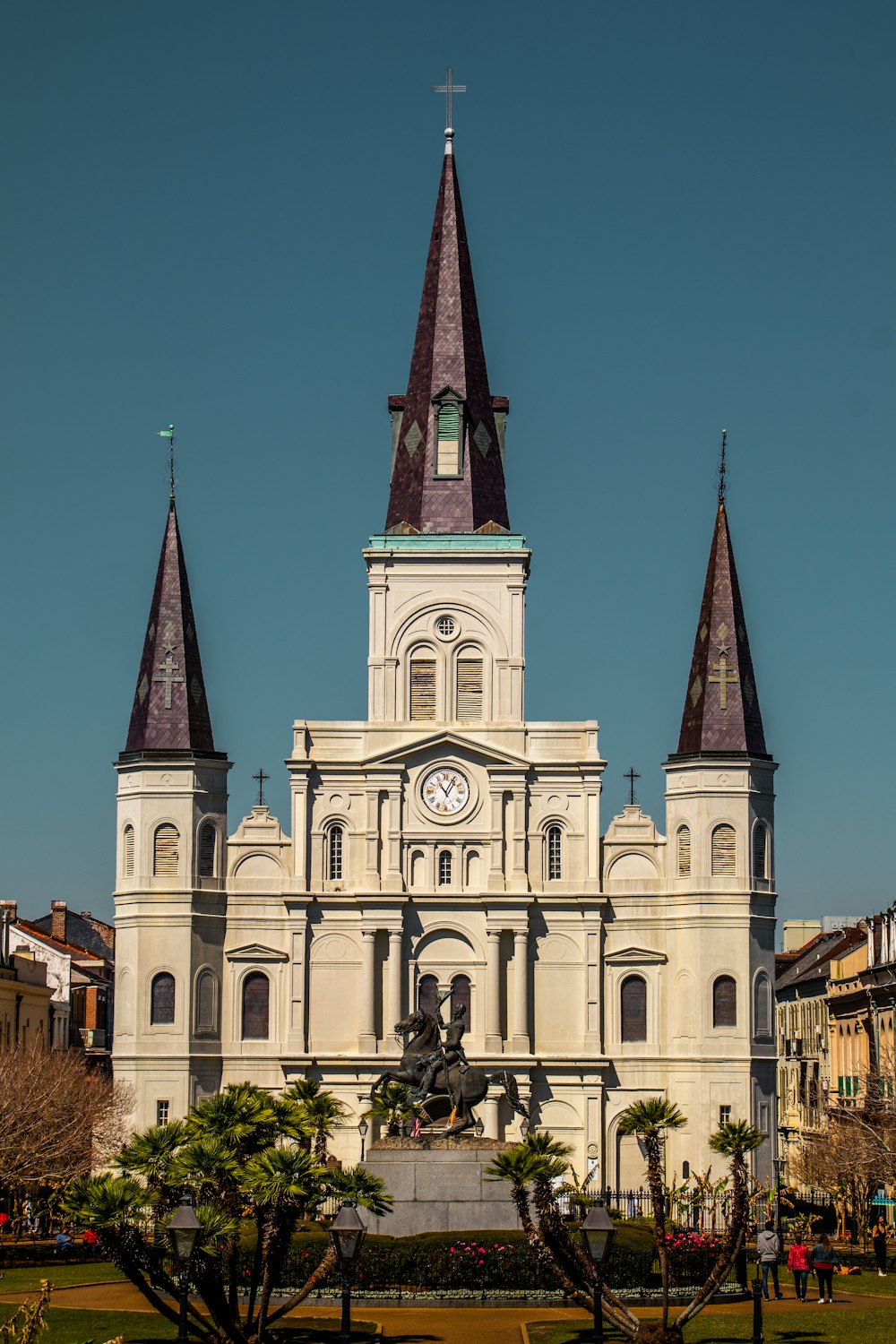 a large white building with a clock tower