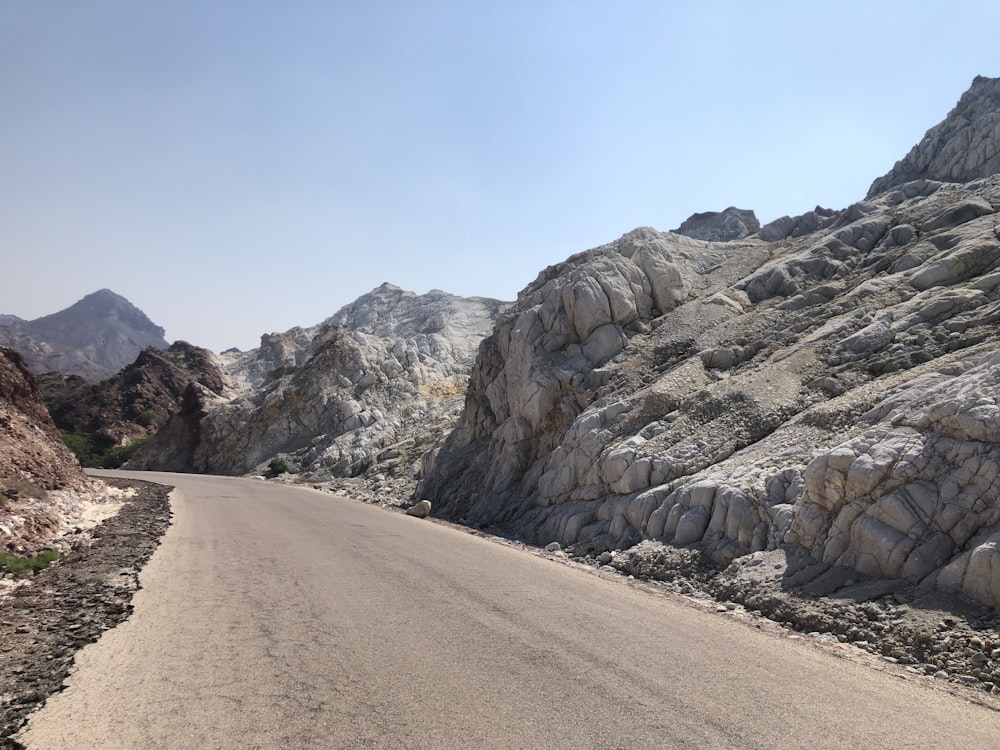 a road with a mountain in the background