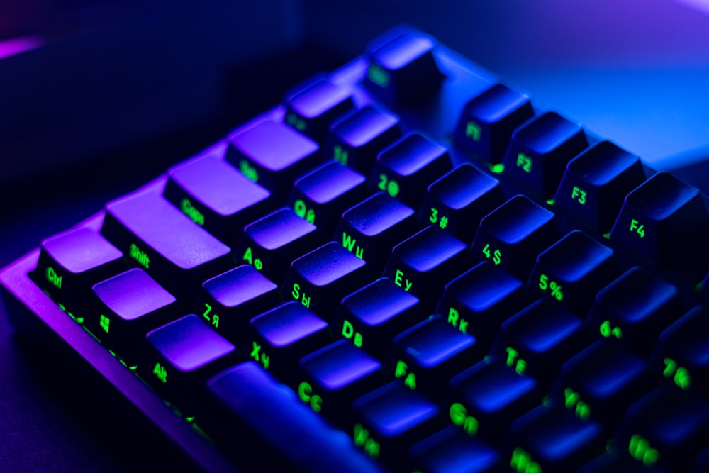 a close up of a keyboard with green keys