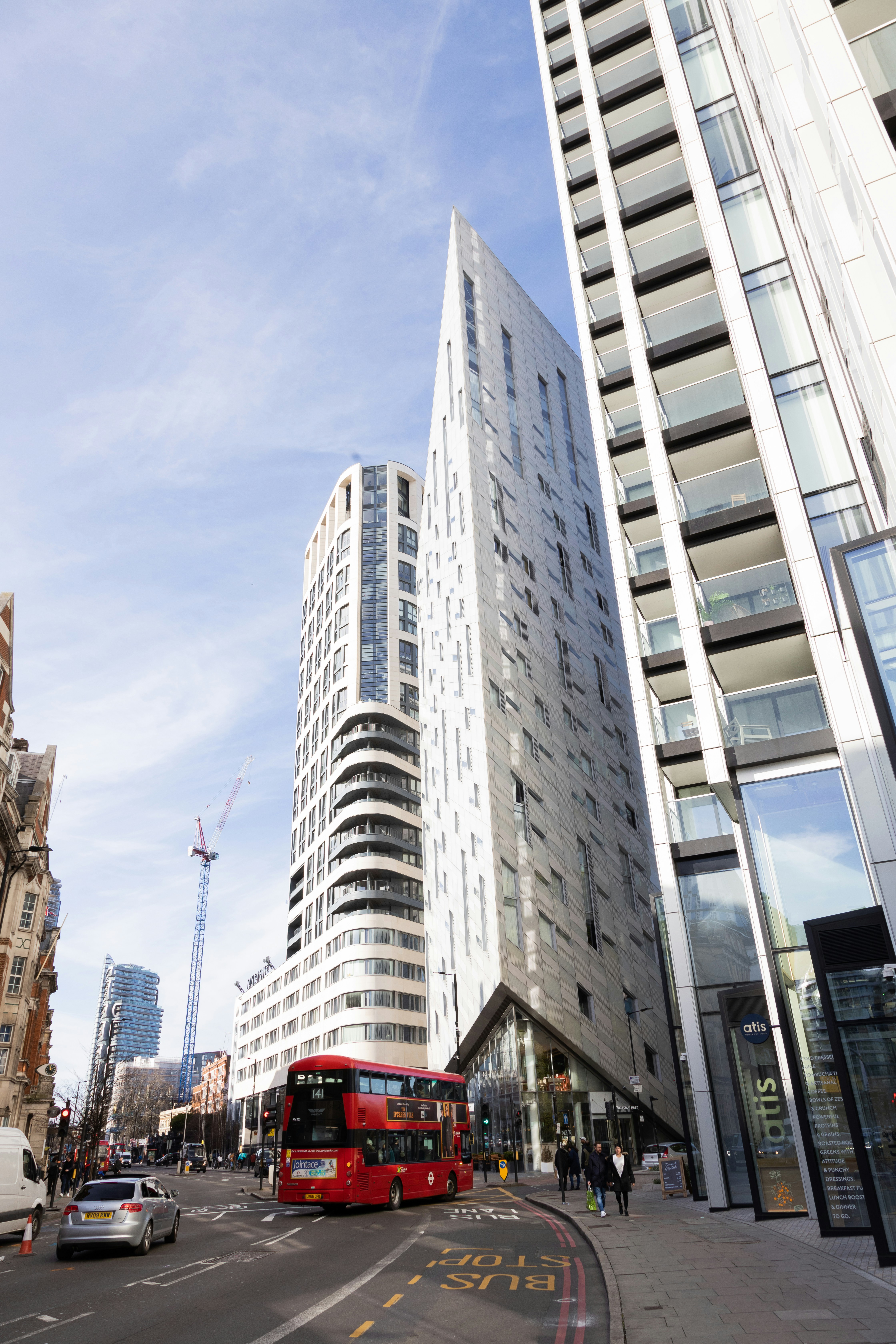 a close up of a busy city street with tall buildings