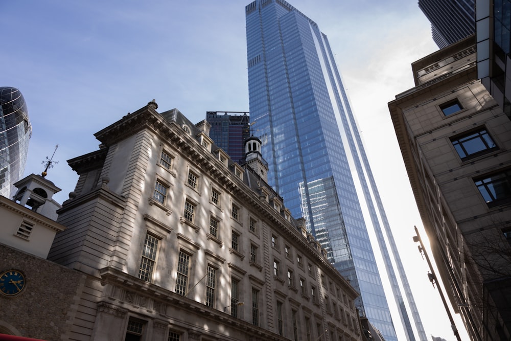 a large tall tower with a clock on the side of a building