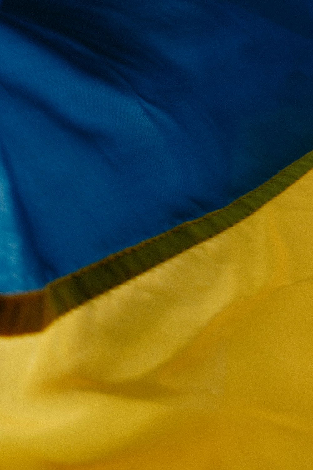 a close up of a yellow and blue flag