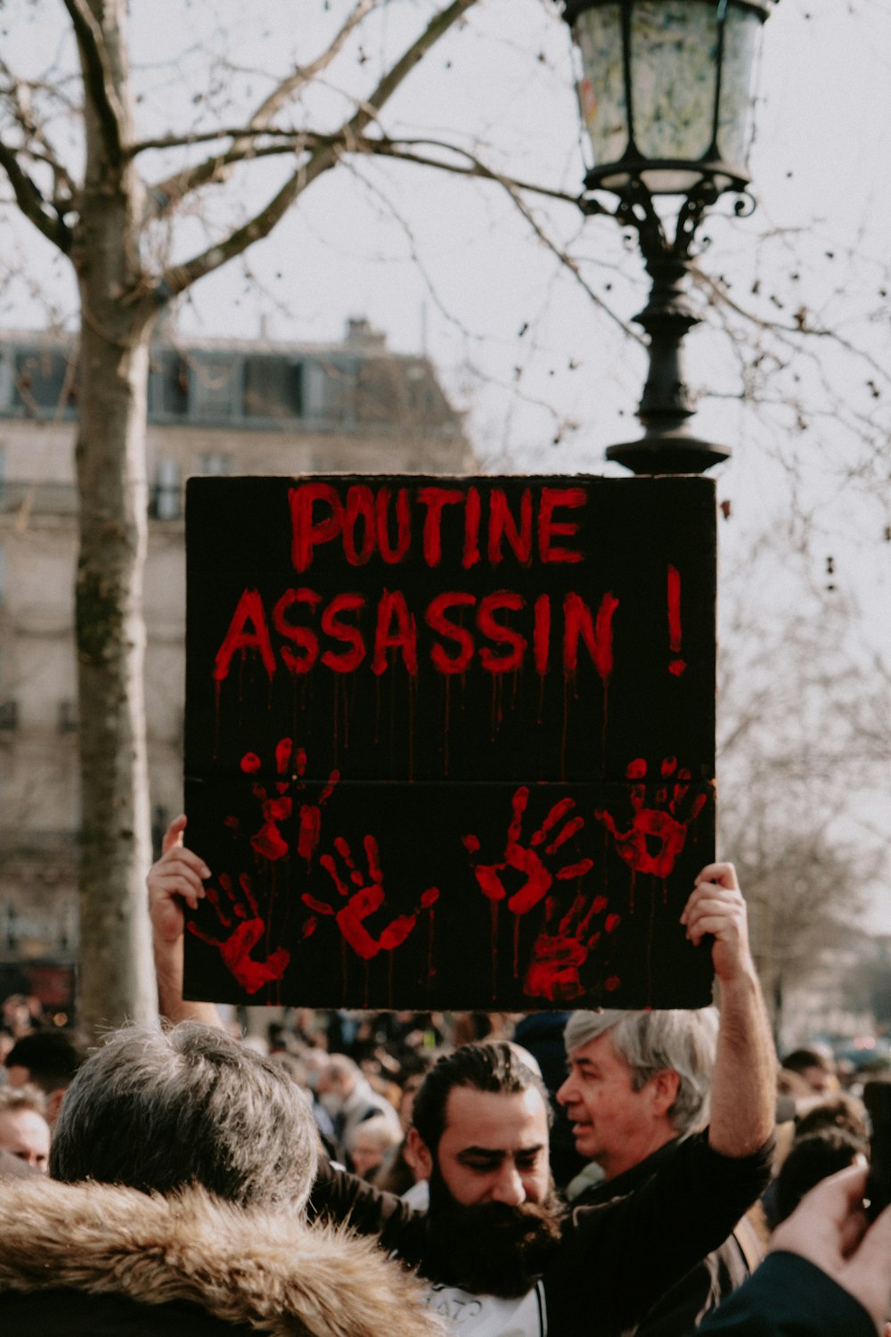 a group of people holding up a sign