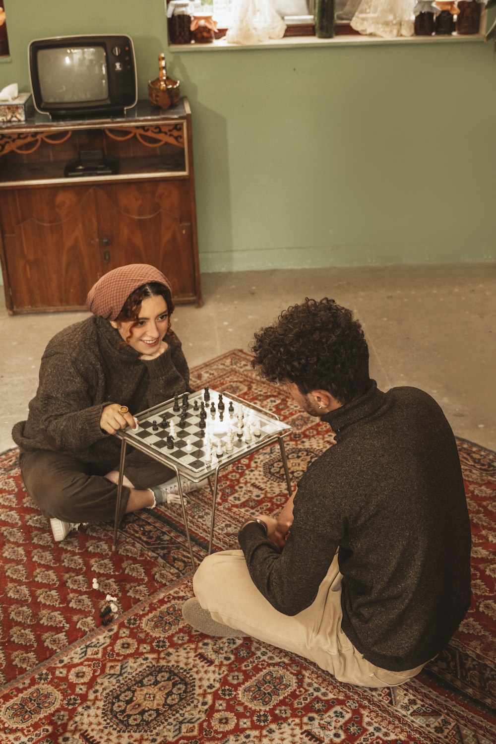 a man and a woman playing a game of chess