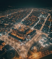 An aerial view of a city with interconnected digital networks.