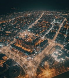 Aerial view of a city skyline with interconnected digital network lines.