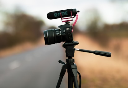 a tripod with a camera attached to it