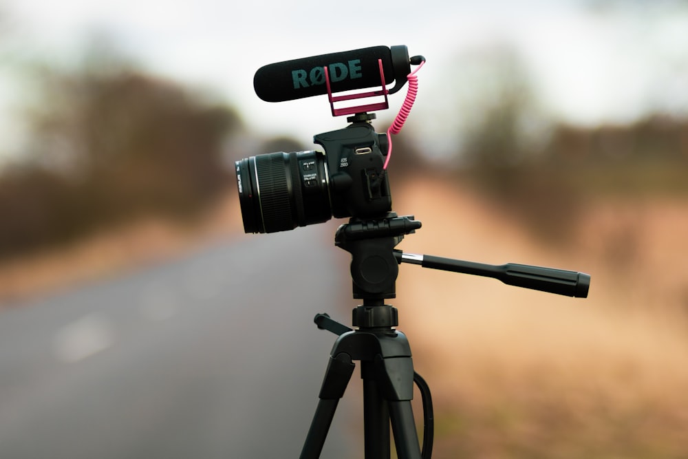 a tripod with a camera attached to it