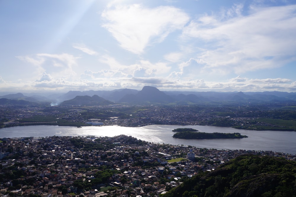 an aerial view of a city and a lake