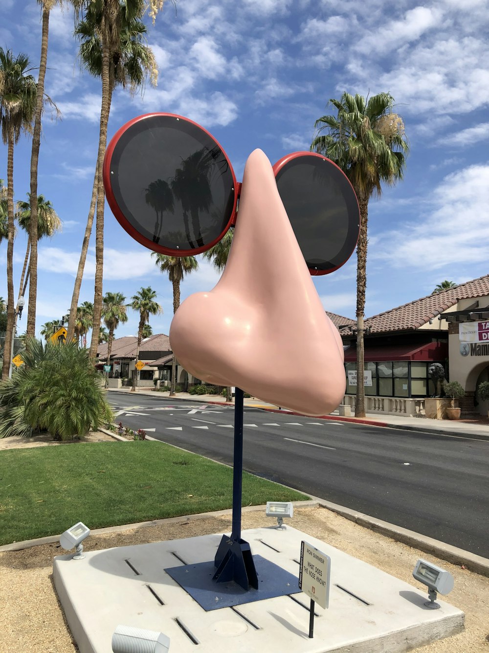 a sculpture of a face with sunglasses on top of it