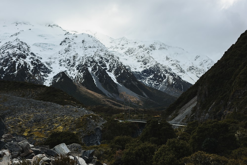 a view of a mountain range with snow on it