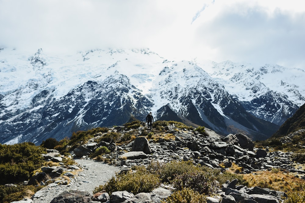 a man standing on top of a rocky mountain