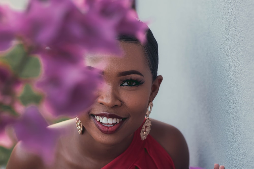 a woman in a red dress with purple flowers