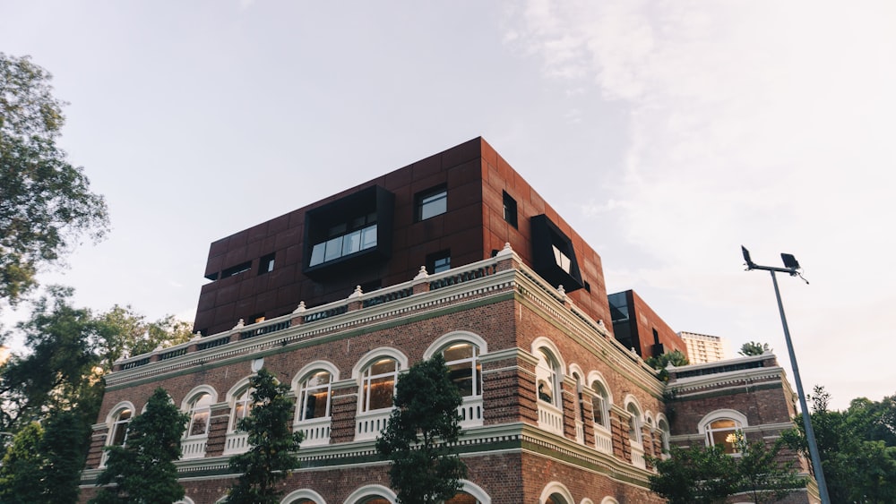 a tall brick building sitting next to a street light