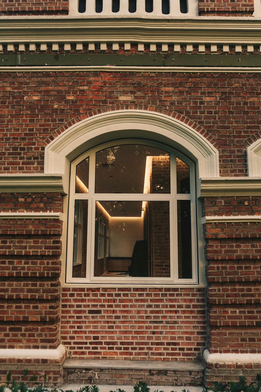 a clock on the side of a brick building