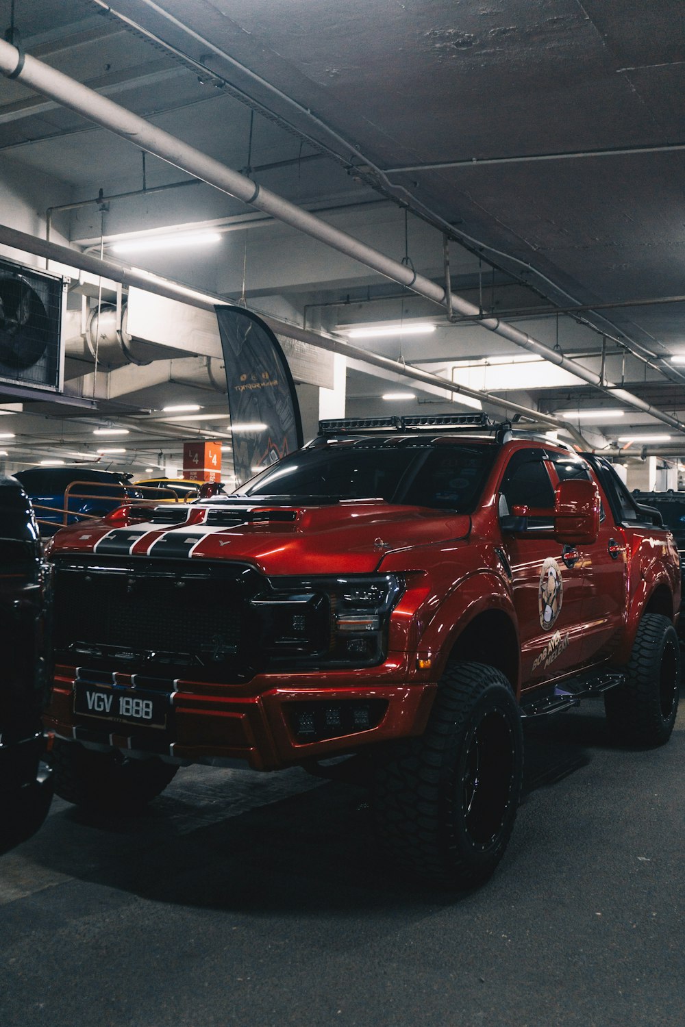 a red truck parked in a parking garage