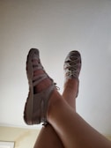 a close up of a person's legs and shoes