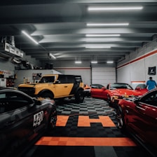 a garage filled with lots of different colored cars