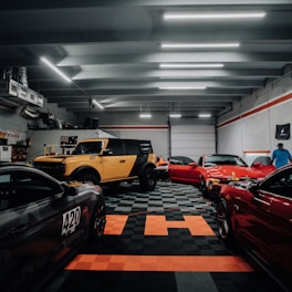 a garage filled with lots of different colored cars