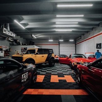 a garage filled with lots of different colored cars