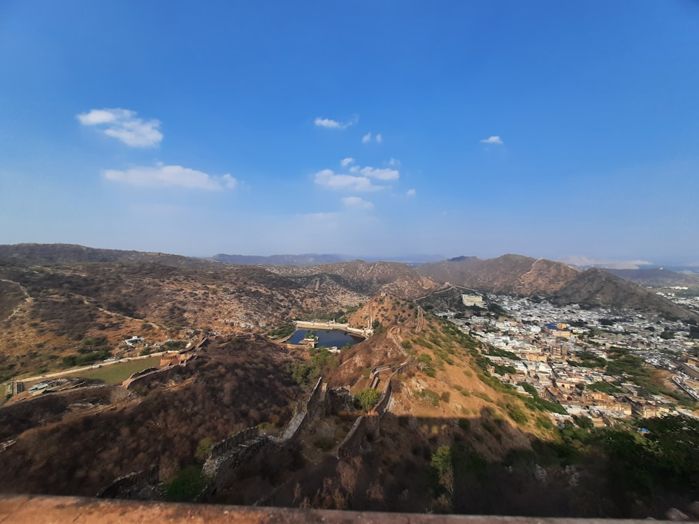 a scenic view of a city from a hill