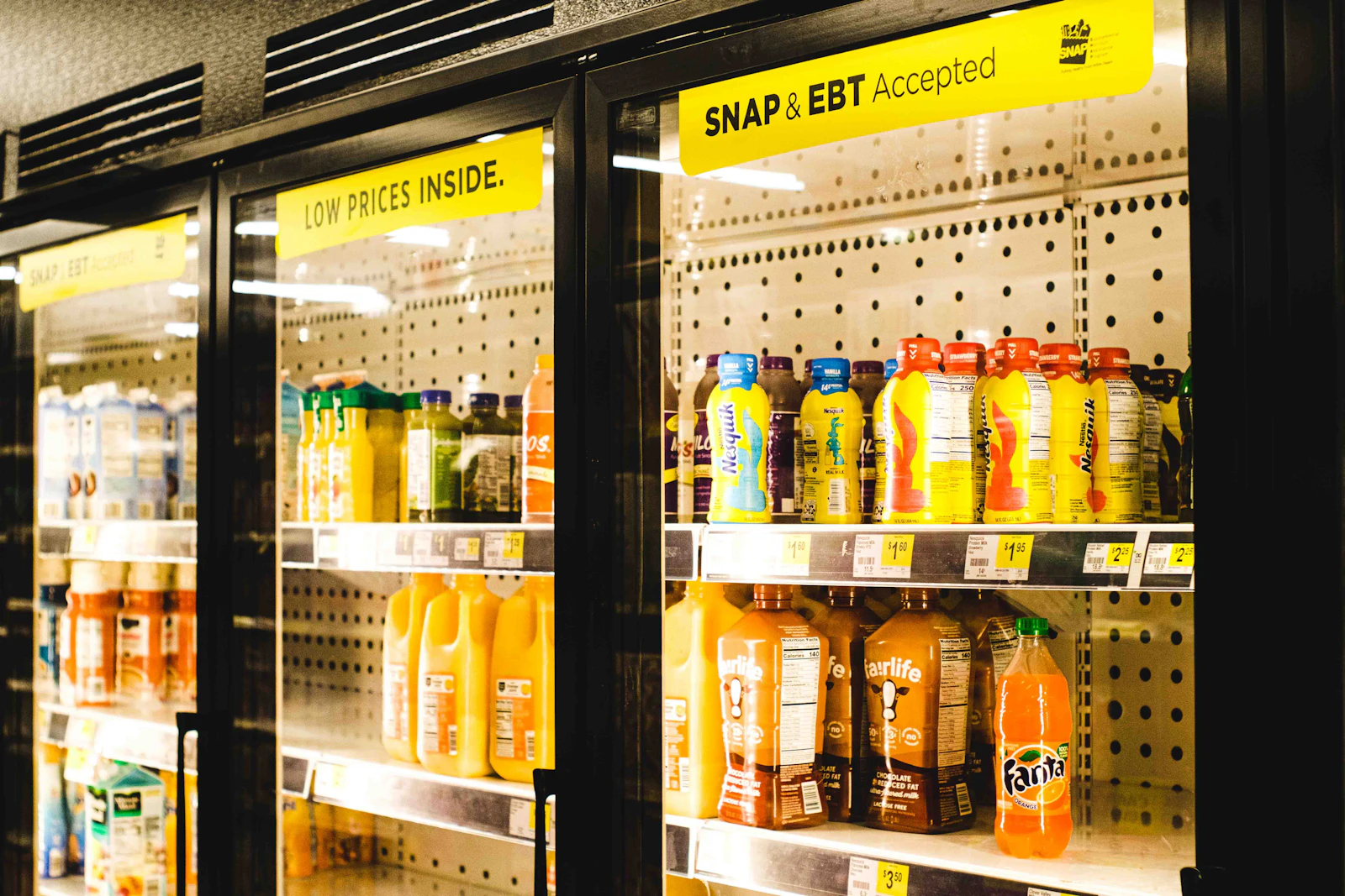 Chilled under-counter display case stocked with packaged product