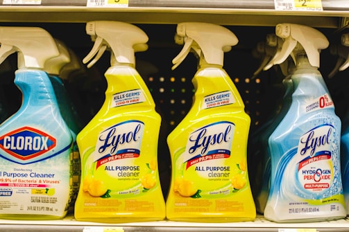 several bottles of lysol all purpose cleaner on a shelf