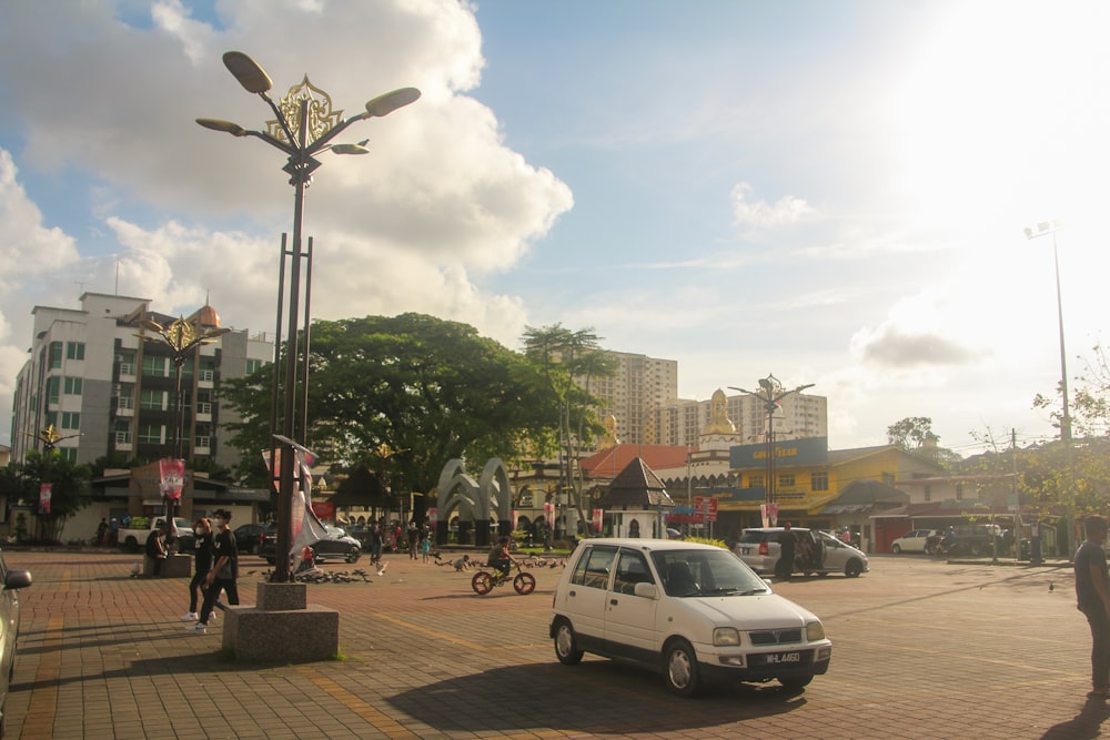 a small white car parked in a parking lot