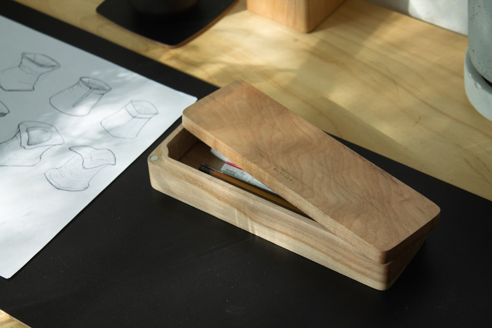 a wooden box sitting on top of a table