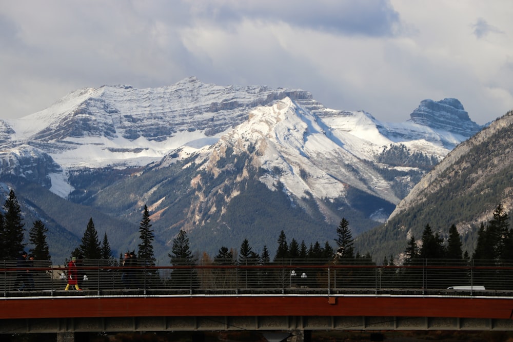 a view of a mountain range from a bridge