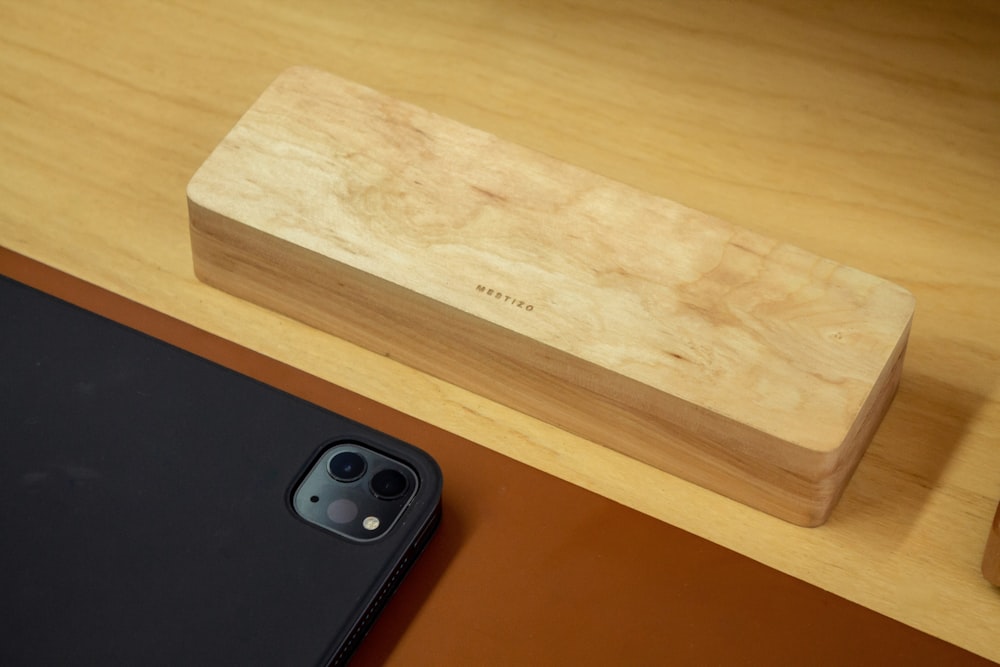 a wooden box sitting on top of a wooden table