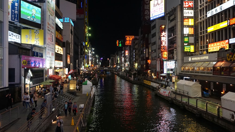 a river running through a city next to tall buildings