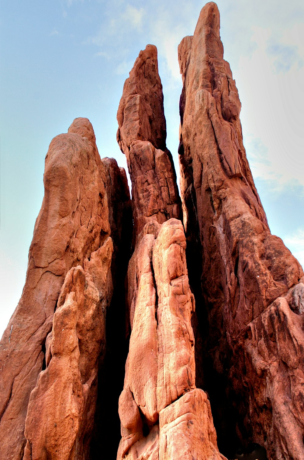 a large rock formation with a sky background