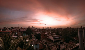 A panoramic cityscape highlighting premium real estate developments at dusk.