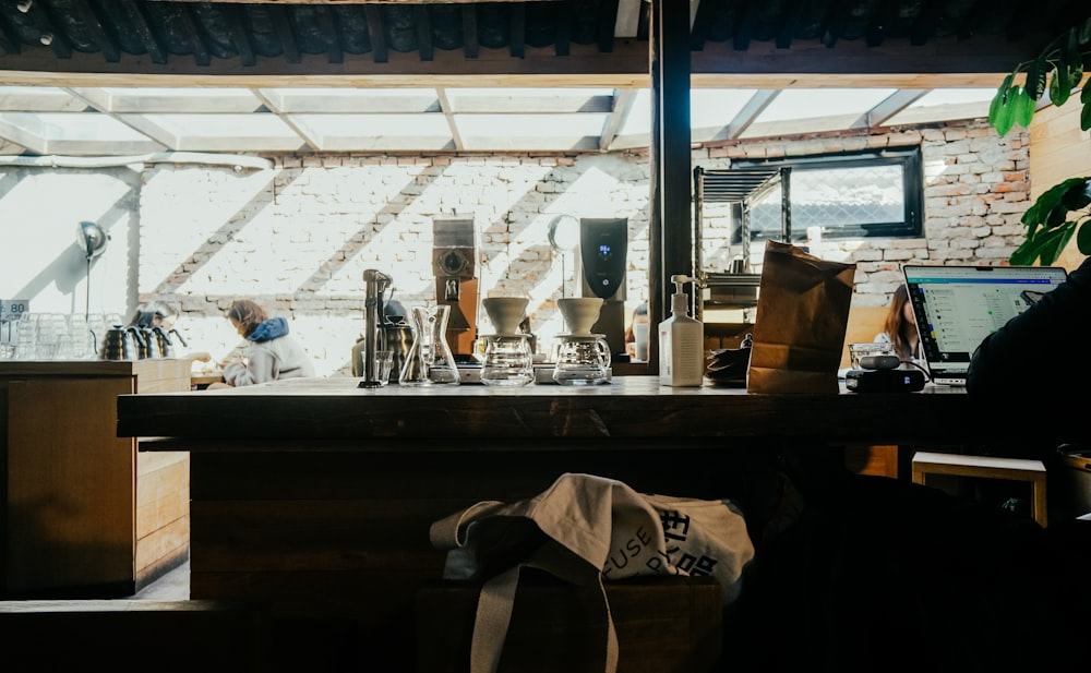 a kitchen with a lot of clutter on the counter